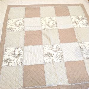 Tan and cream quilt, full/queen size